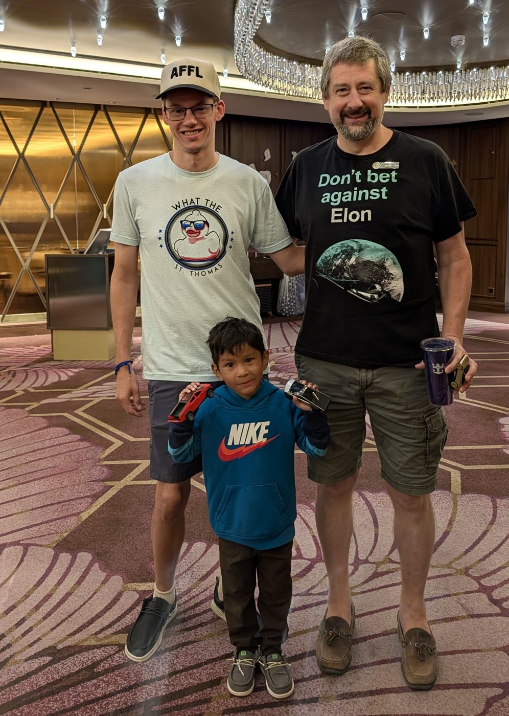 Finley, holding his Cybertruck prize, with Andy